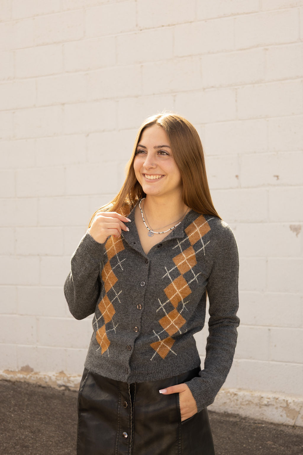 Grey cardigan with argyle pattern on the front