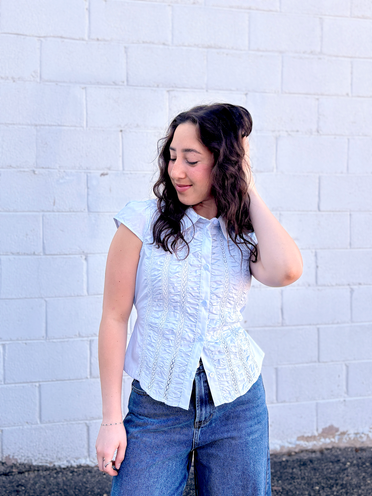 light blue button up top with ruching and a tie in the back