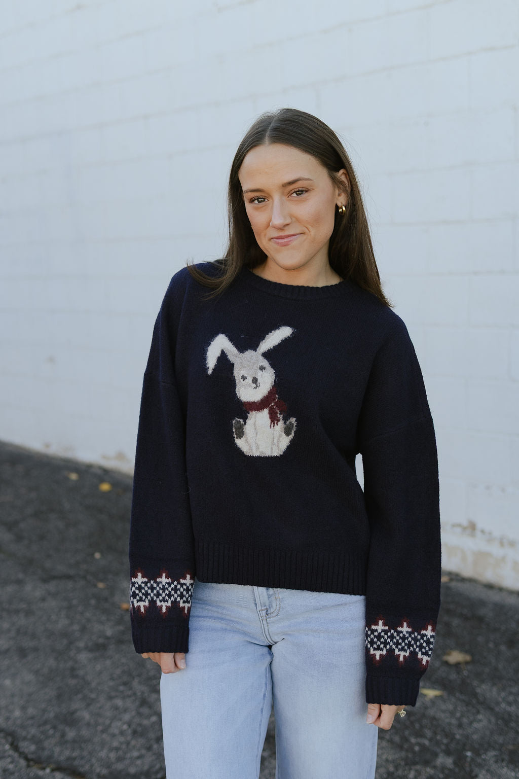 navy blue sweater with bunny print on the front