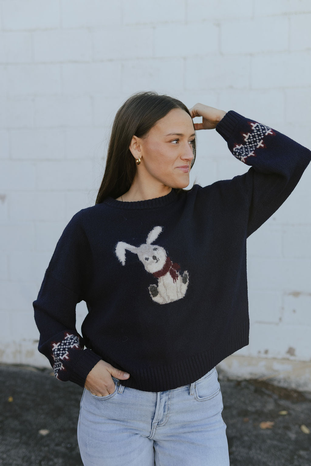 navy blue sweater with bunny print on the front