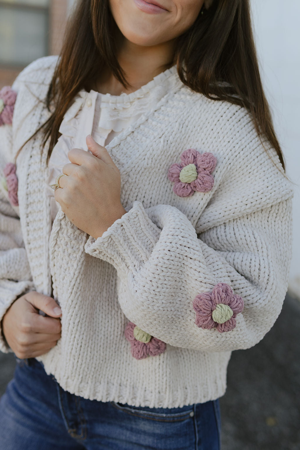 chunky knit cardigan with appliqué flowers