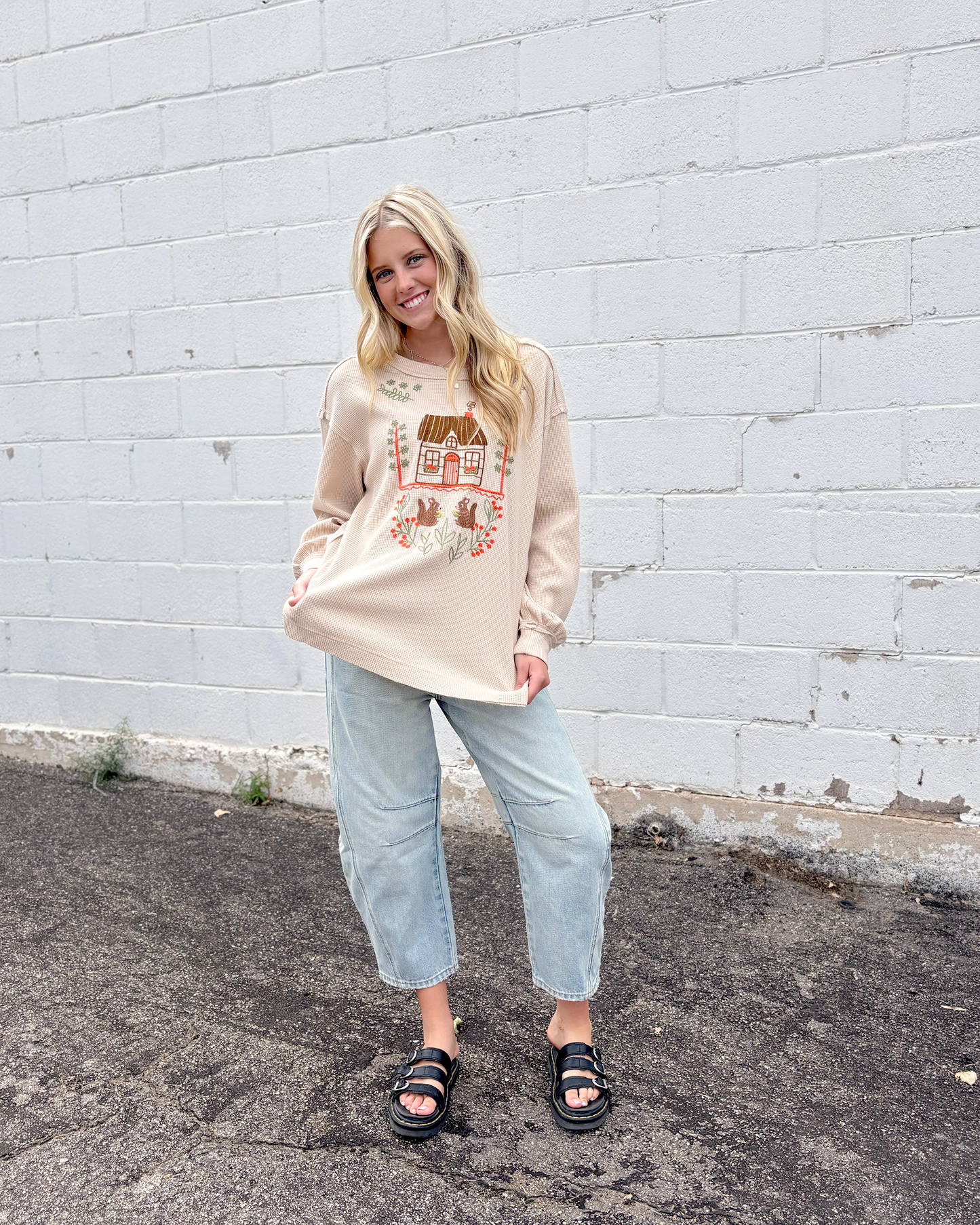 Cute tan thermal top with embroidered squirrel family on the front