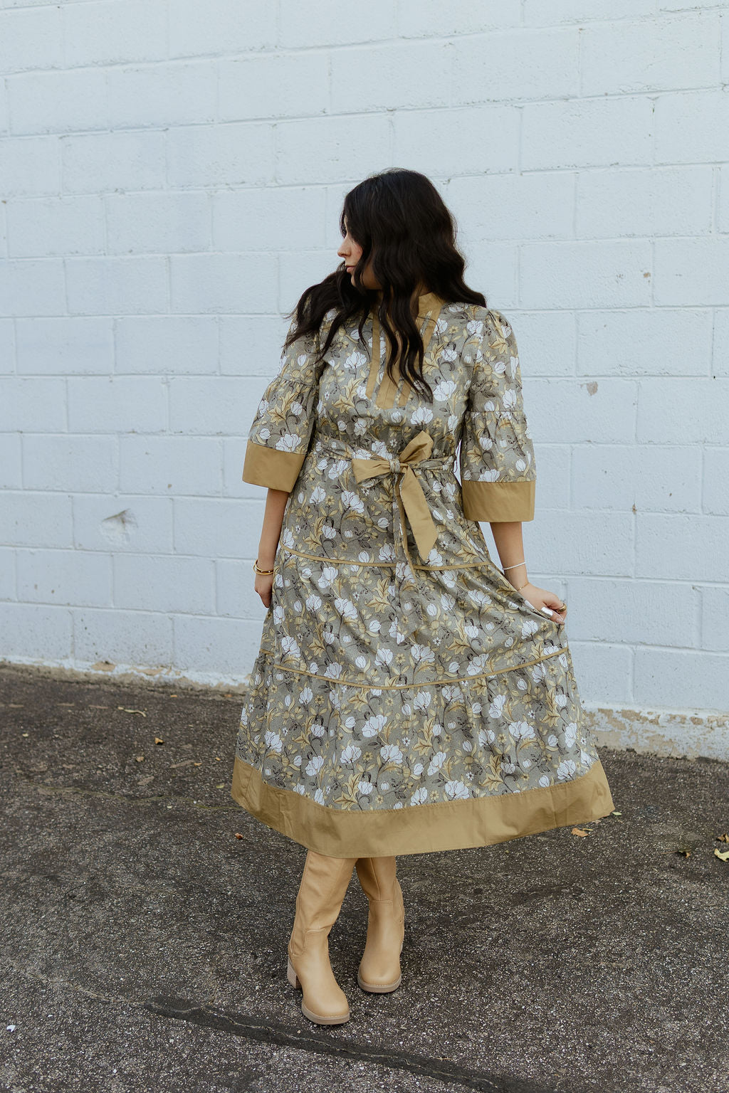 Neutral floral dress with tan accents and bow tie belt