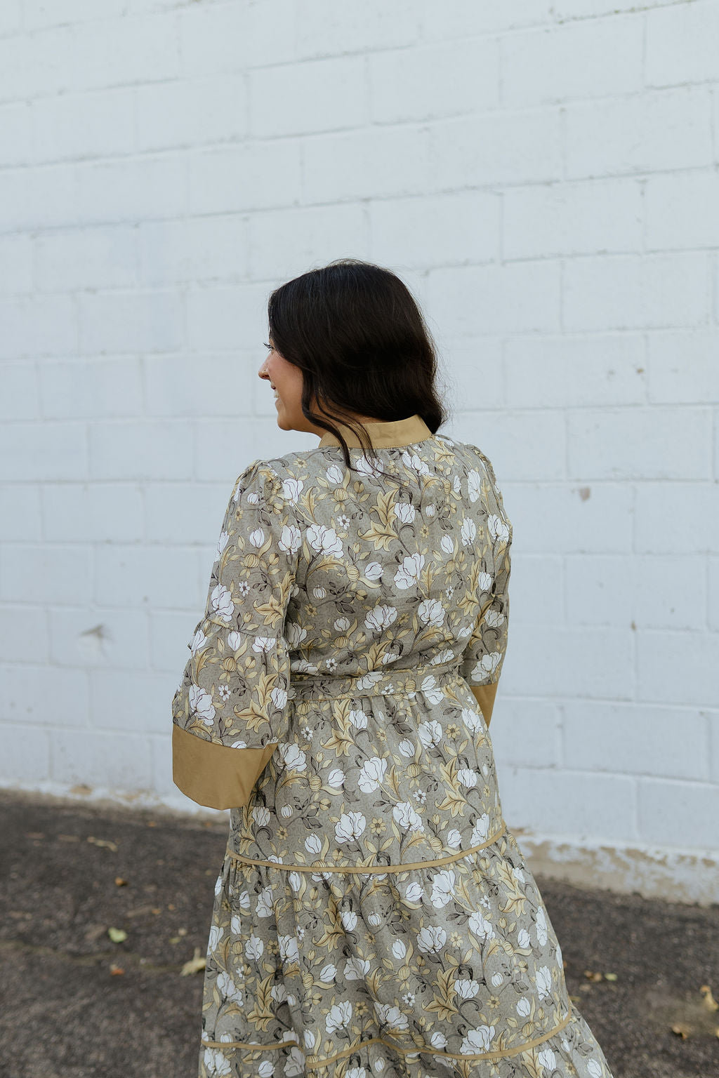 Neutral floral dress with tan accents and bow tie belt