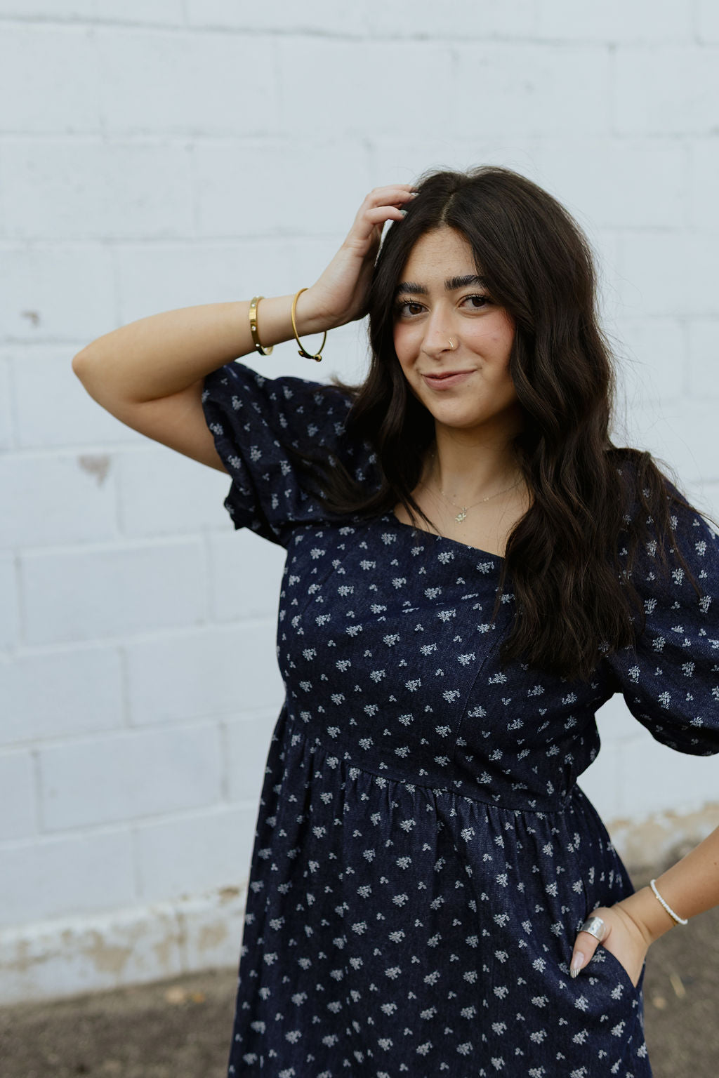 Indigo denim dress with white floral embroidery and puff sleeves