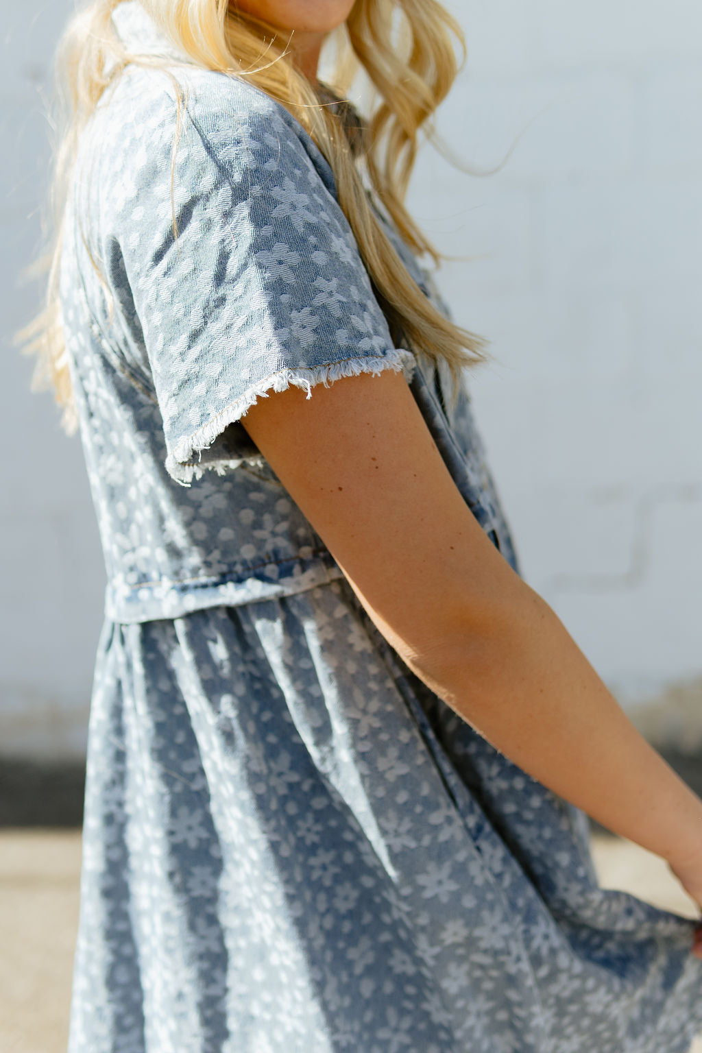 Denim a-line dress with light colored floral pattern