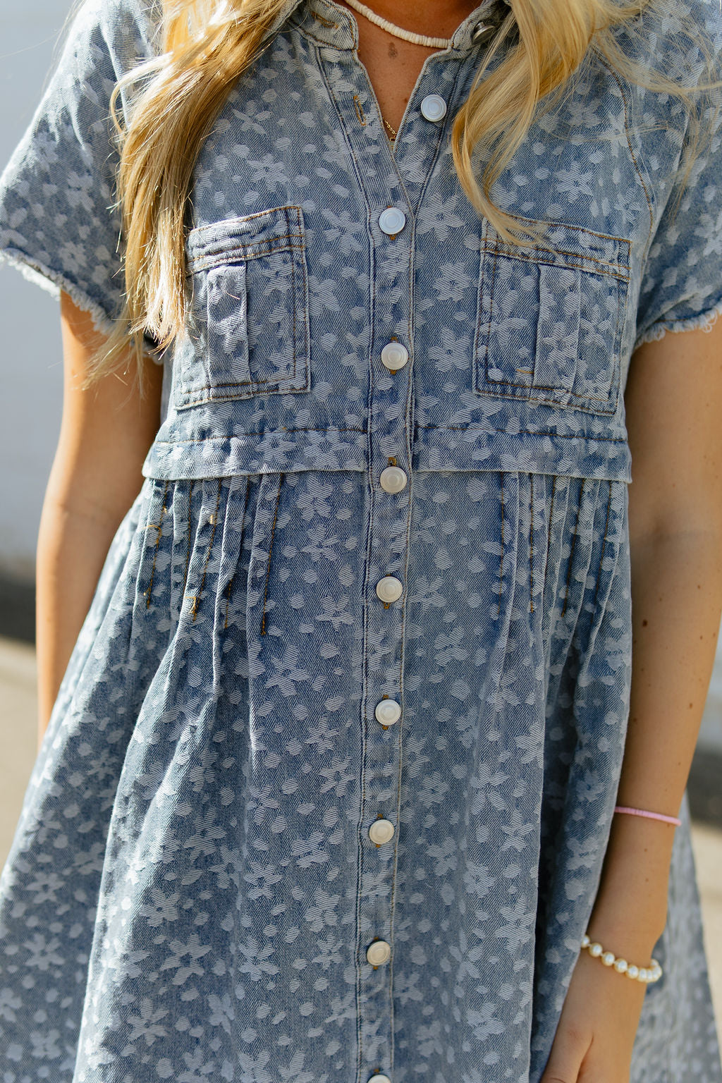 Denim a-line dress with light colored floral pattern