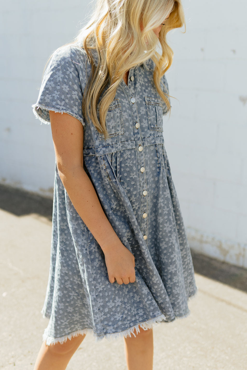 Denim a-line dress with light colored floral pattern