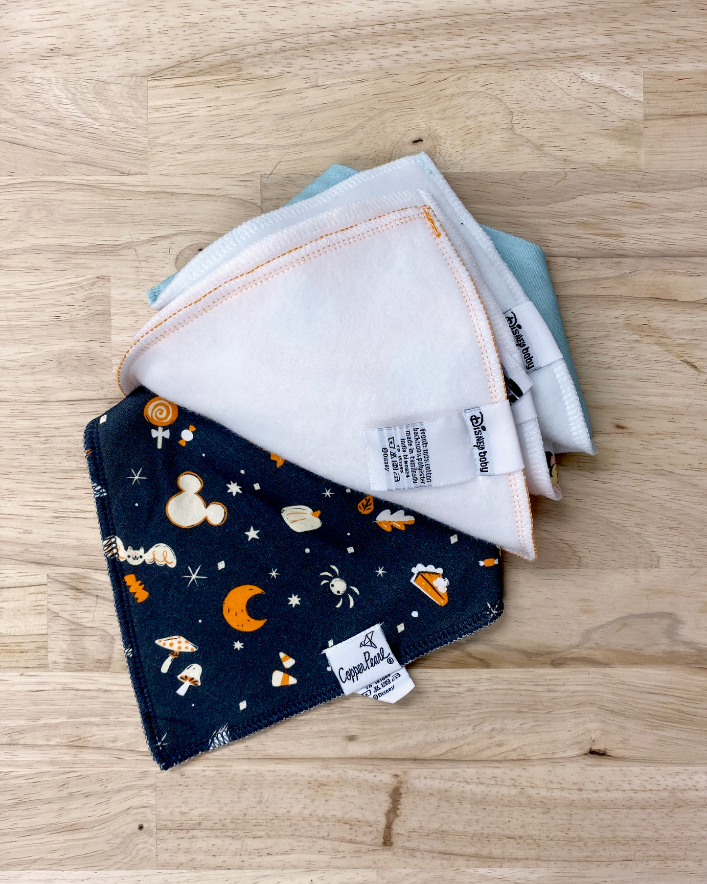 Disney print copper pearl bib set