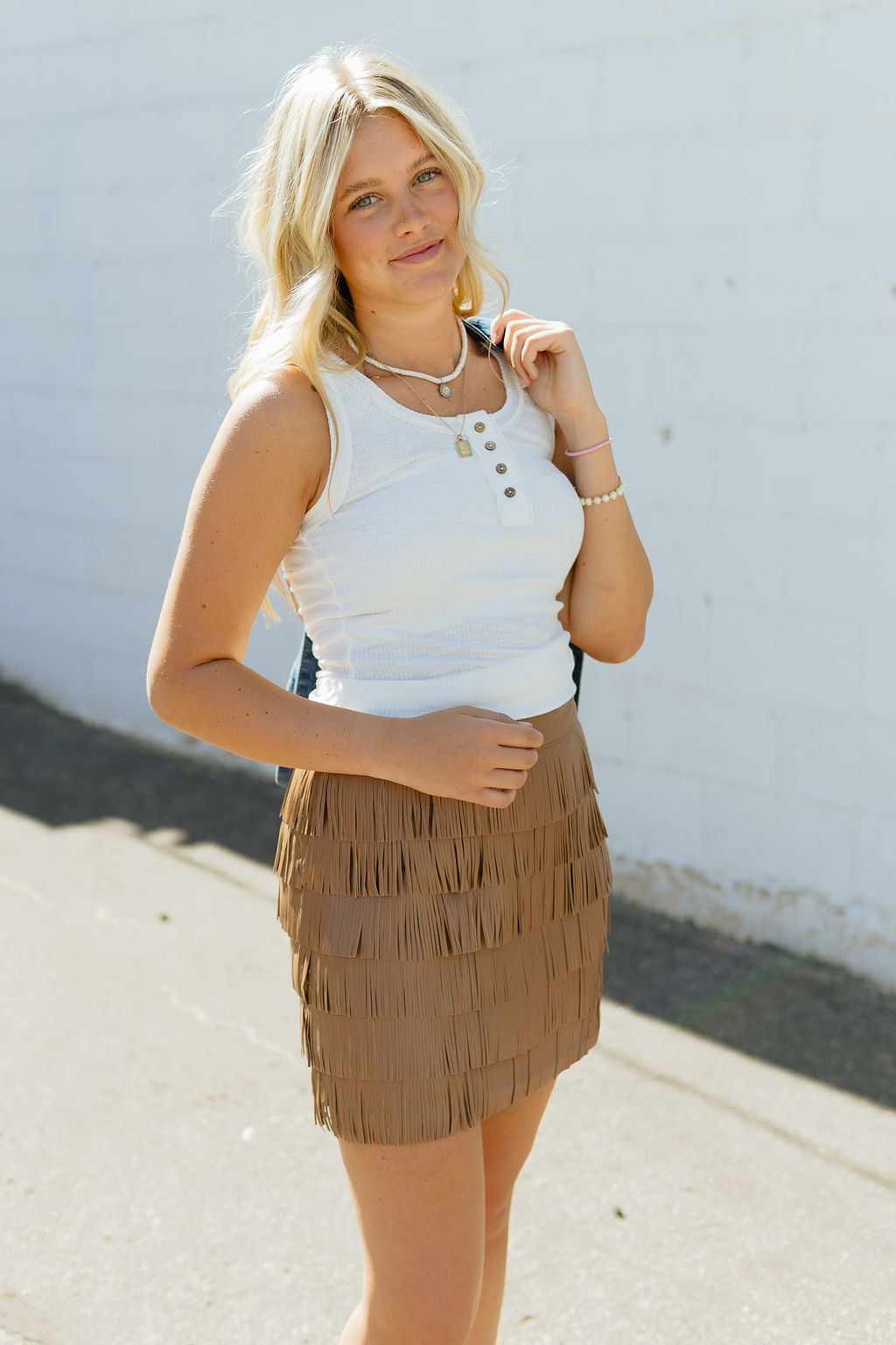 Tan fringe mini skirt