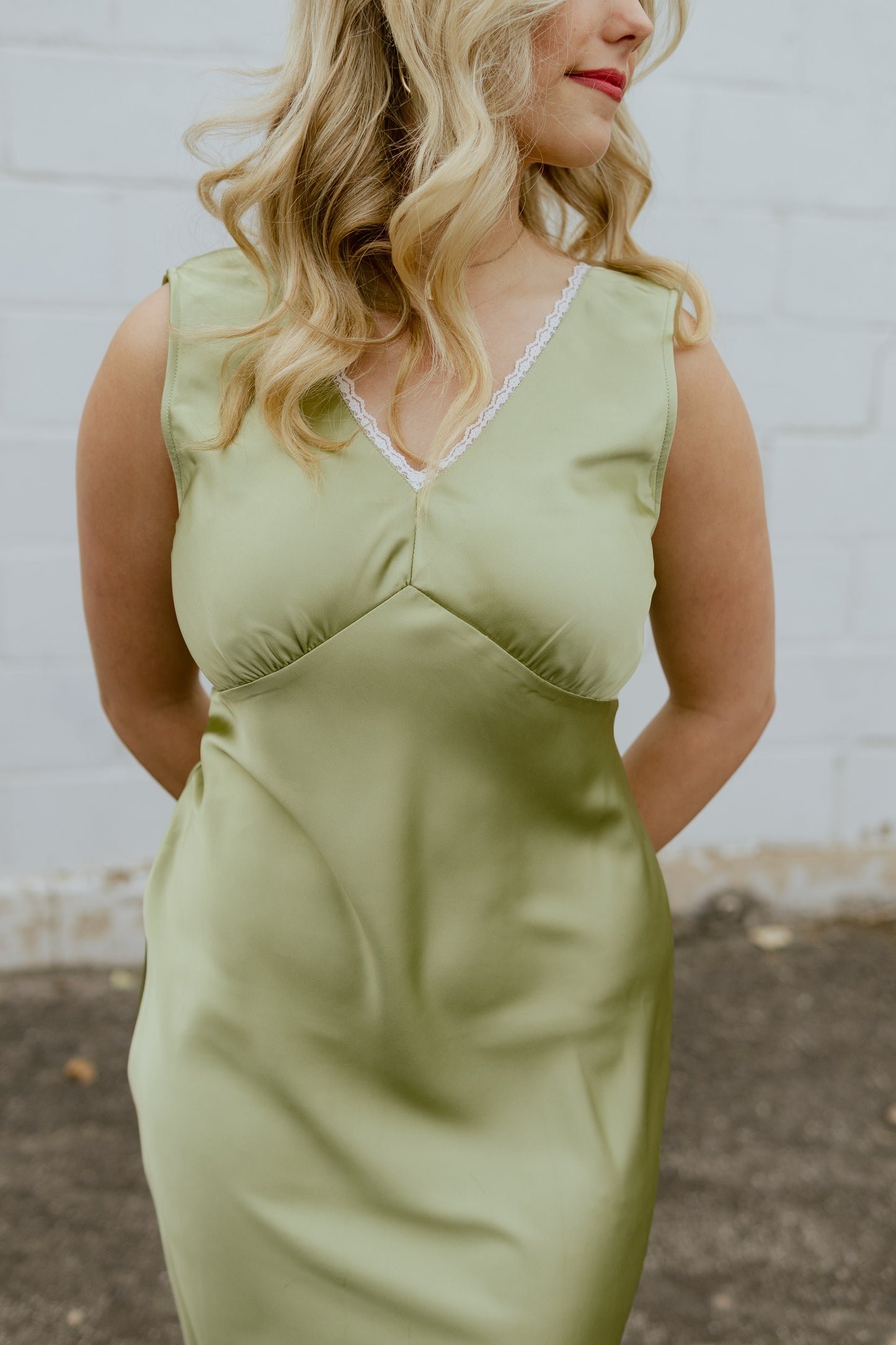 Light green silk dress with v neck and lace trim
