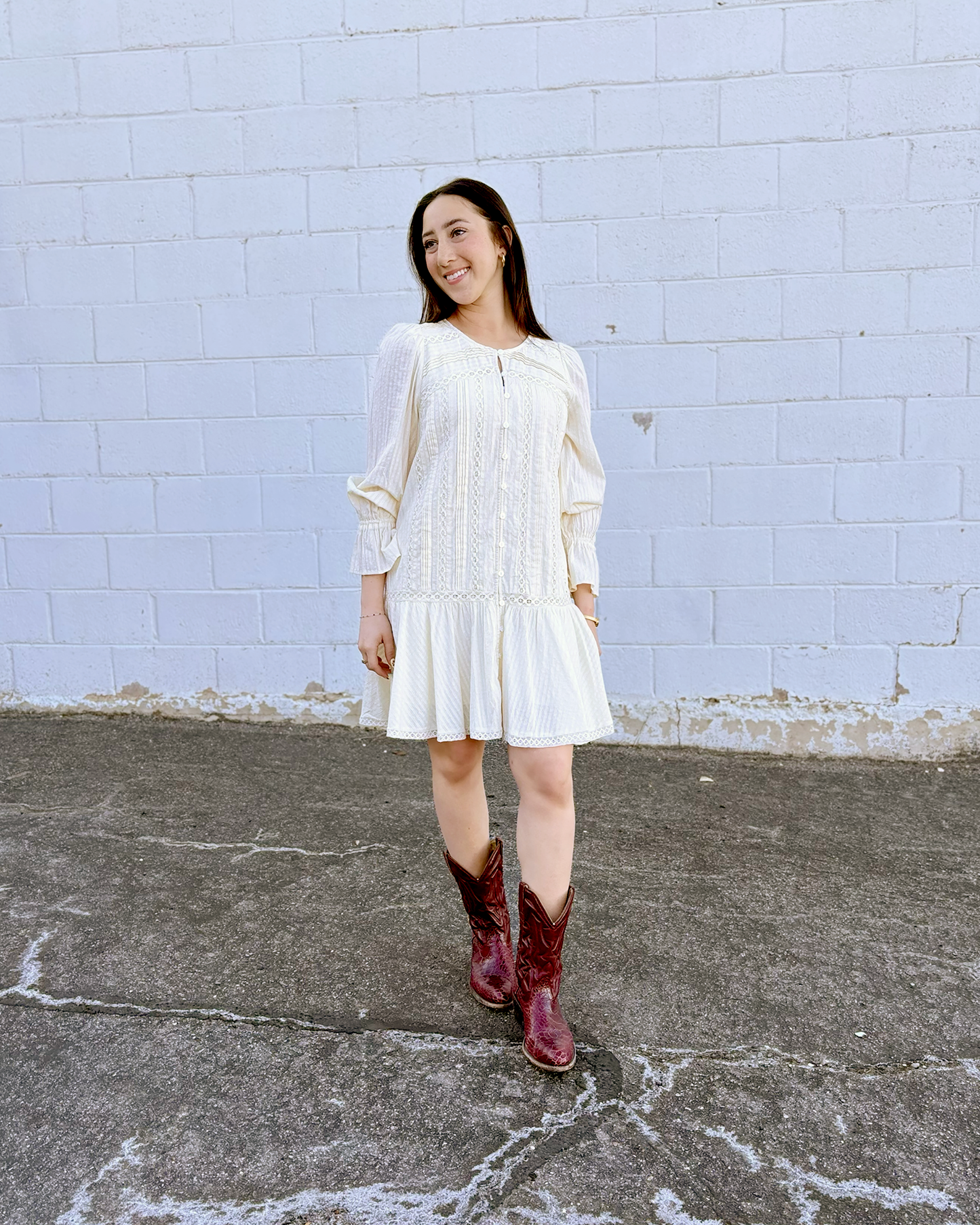 Ivory long sleeve short dress with lace details and a drop waist