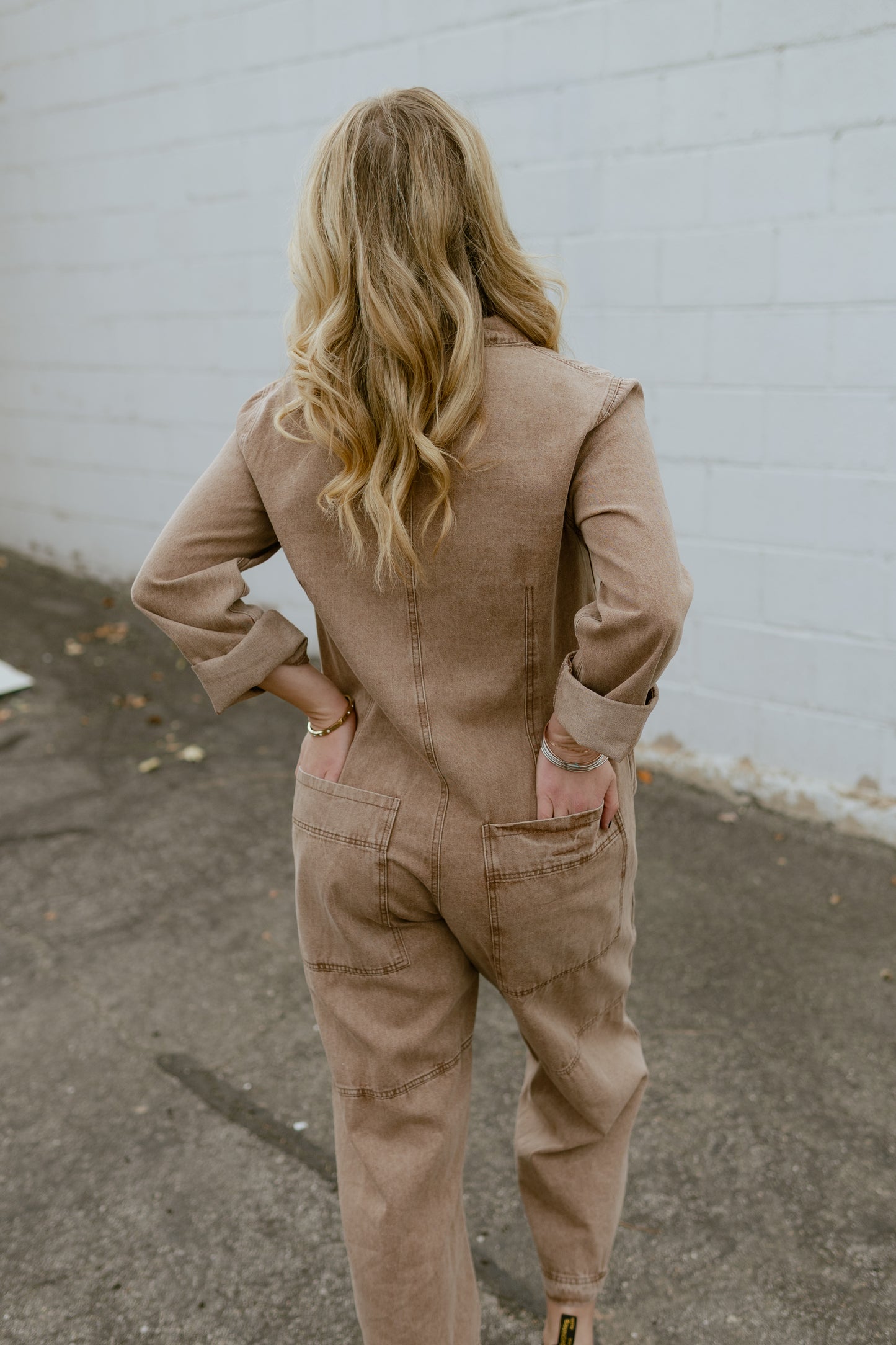 Tan jumpsuit, button up with long sleeves