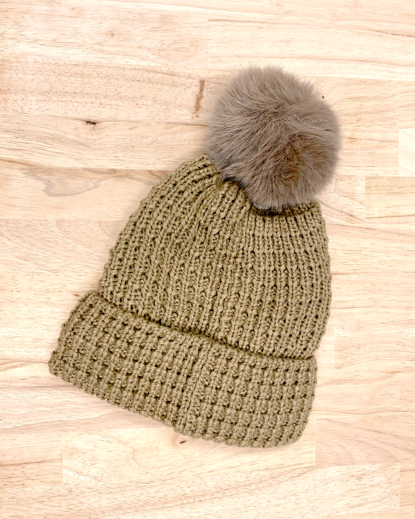 knitted beanie with puff ball