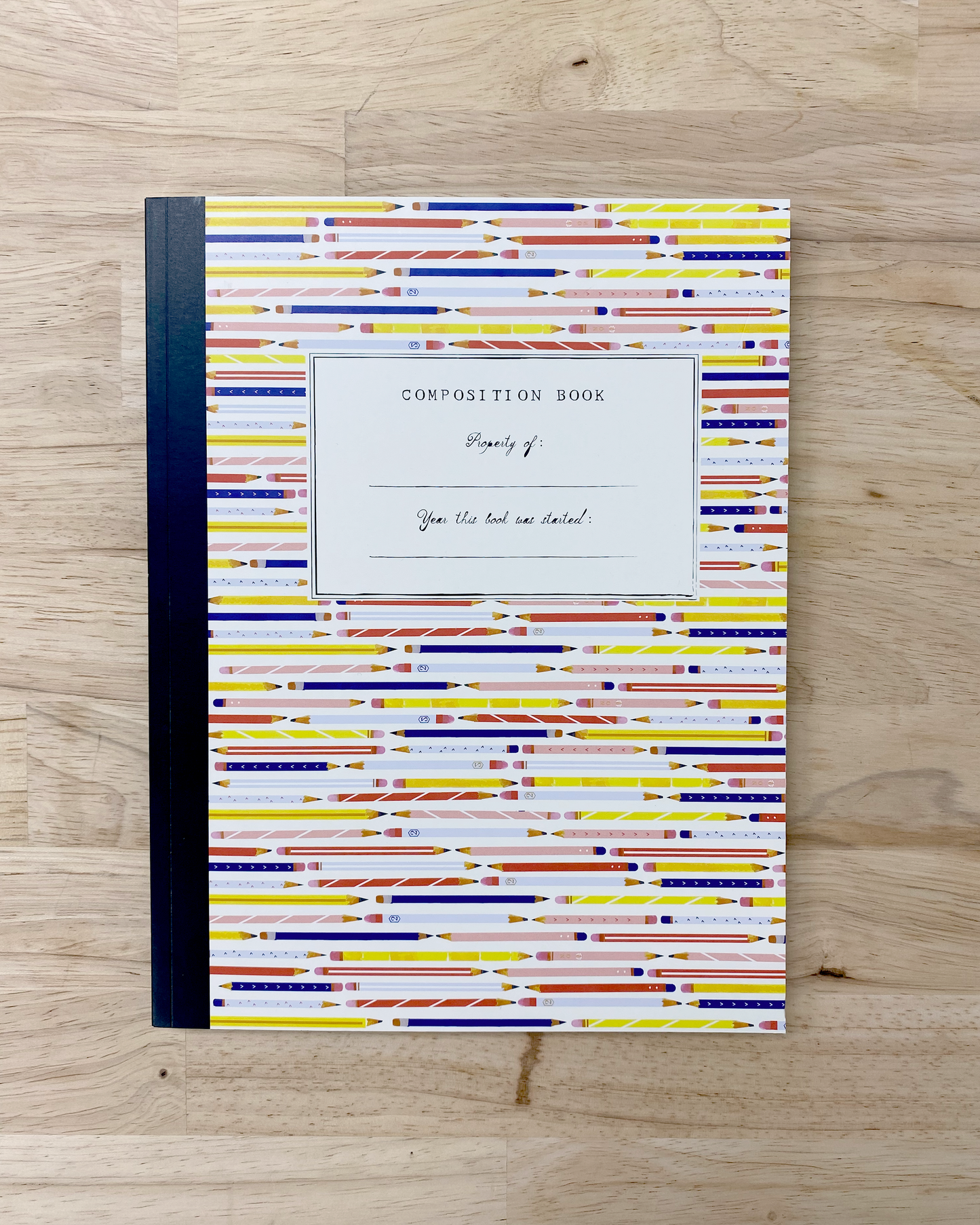 Cute composition notebook with illustrated pencils on the front and back cover