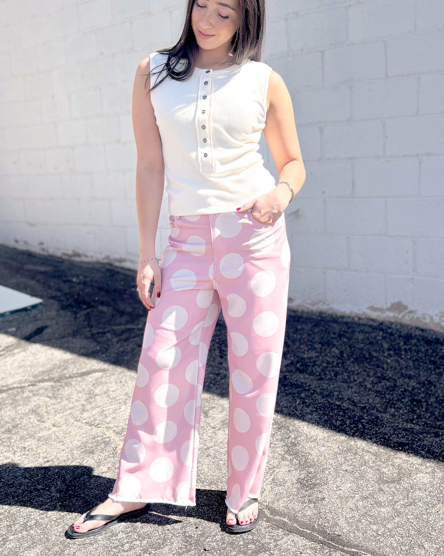 Pink wide leg pats with a big white polka dot print