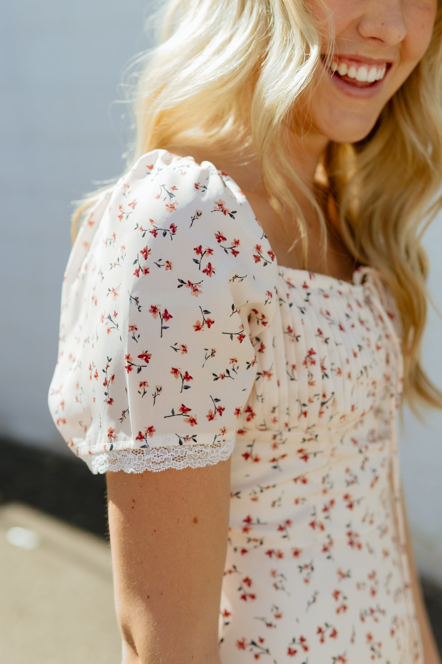Beautiful Ivory dress with light red floral pattern and pleated bust