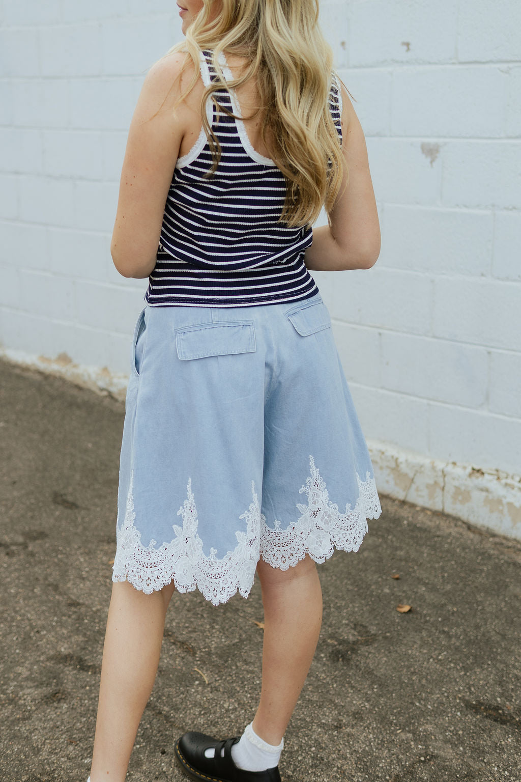 Soft denim shorts with lace trim along the bottom