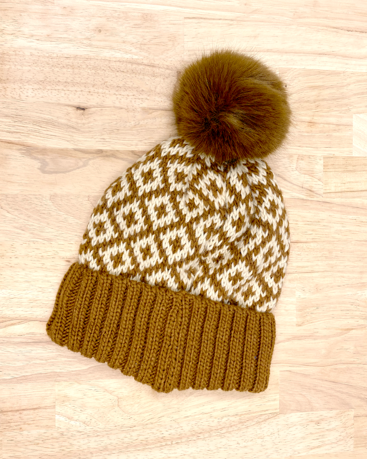 knitted beanie with puff ball