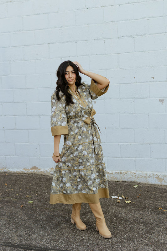 Neutral floral dress with tan accents and bow tie belt