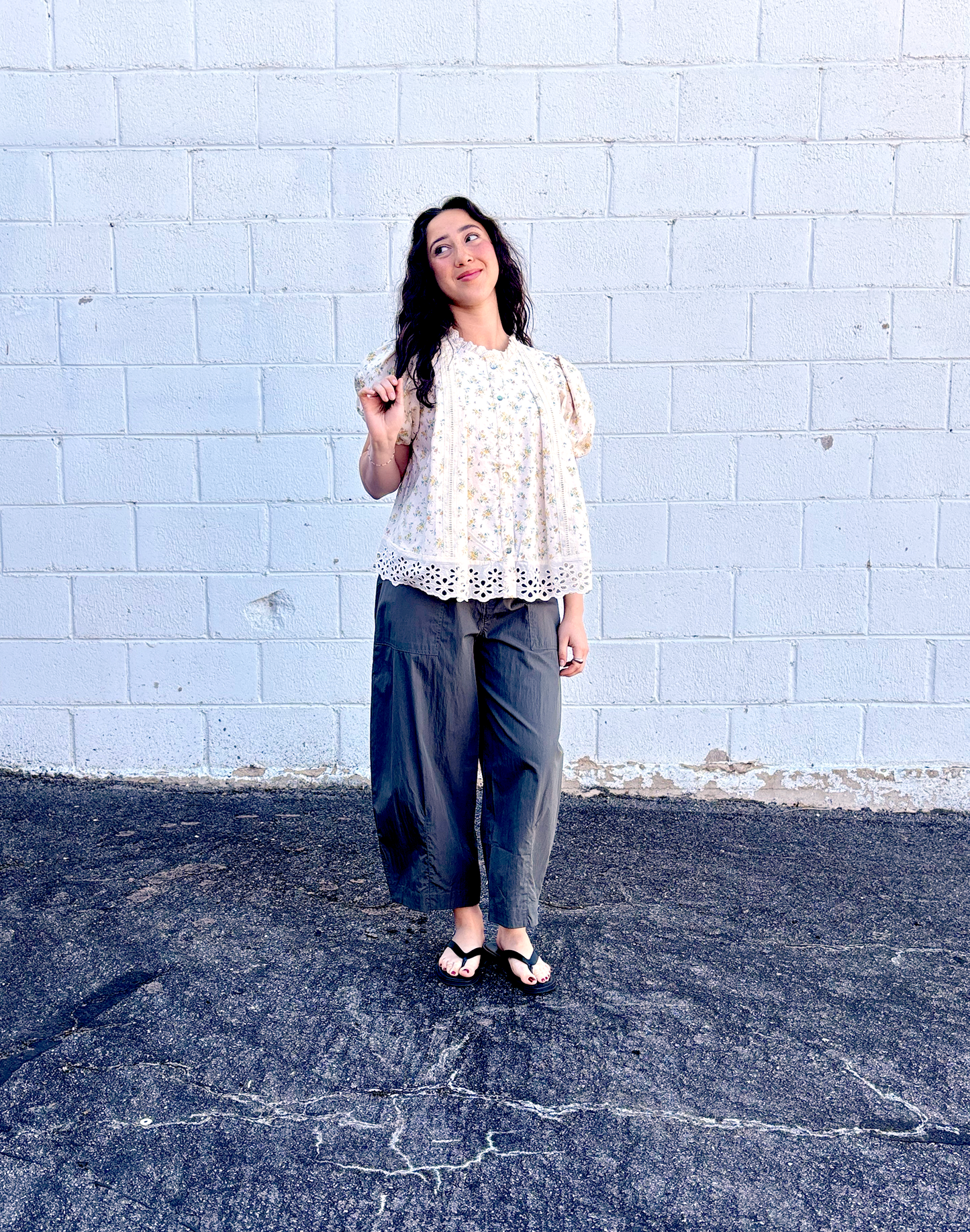 Yellow flowered top with large lace trim along the bottom