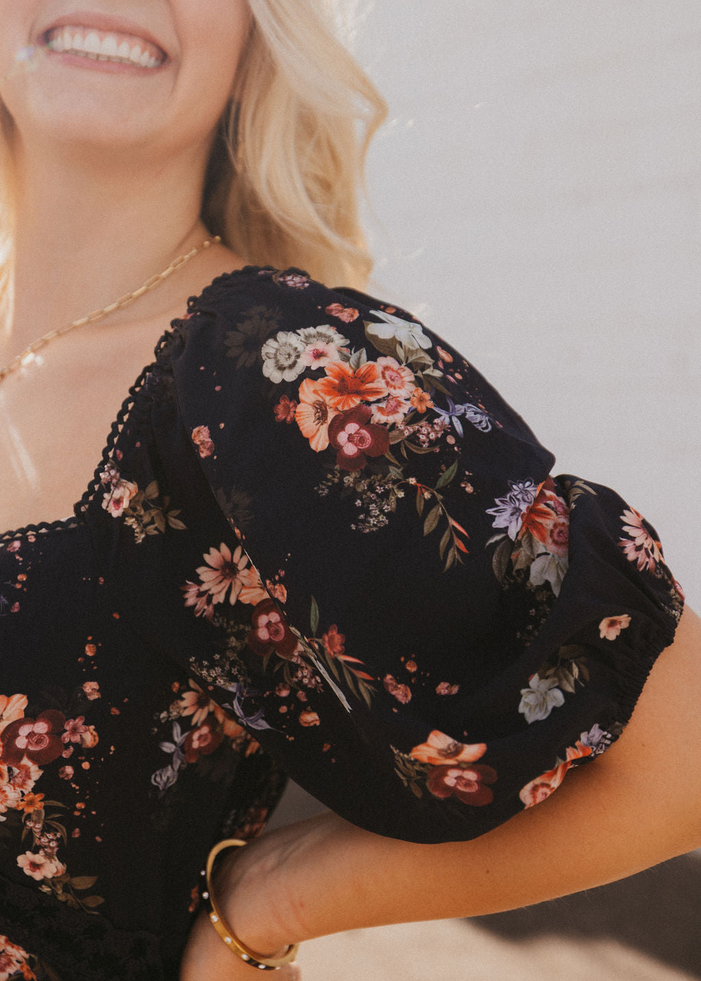 black dress with fall floral pattern and black lace trim