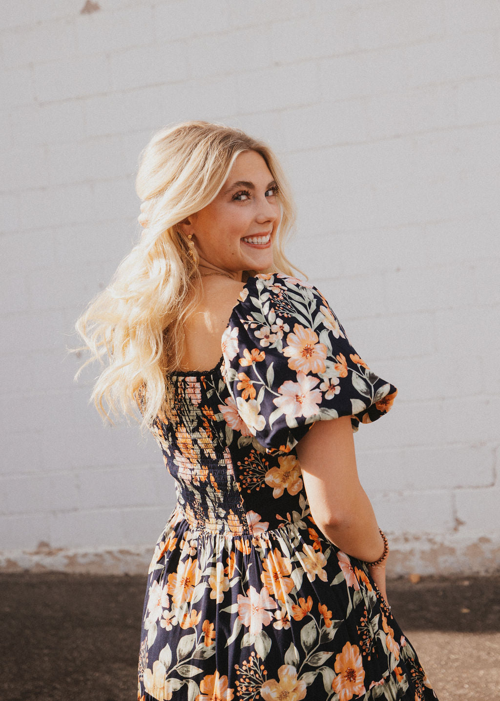 black floral dress with sweetheart neckline and puff sleeves