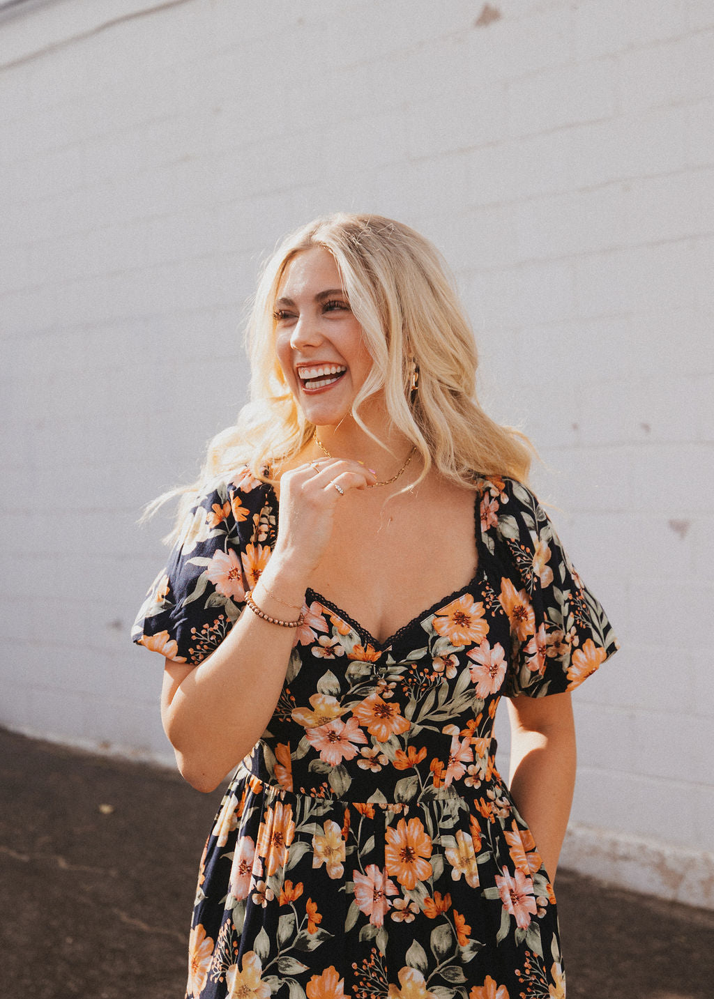 black floral dress with sweetheart neckline and puff sleeves