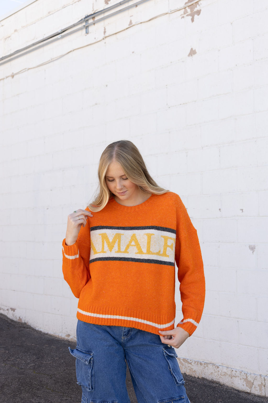 cute orange sweater with Amalfi across the front