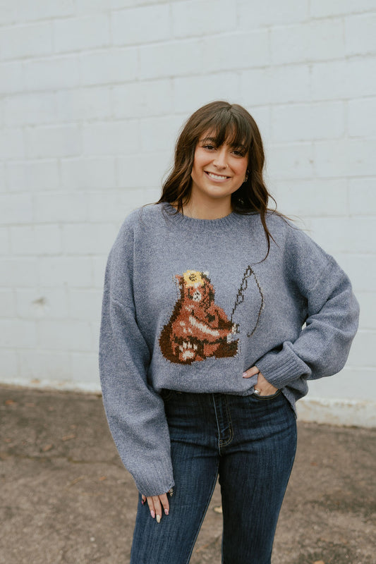 Cute blue sweater with bear fishing on the front