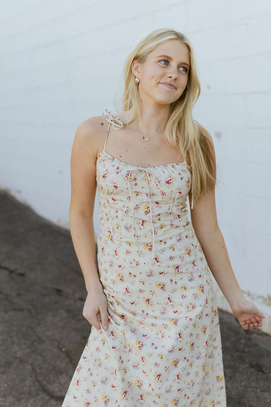 beige dress with red and yellow flower print