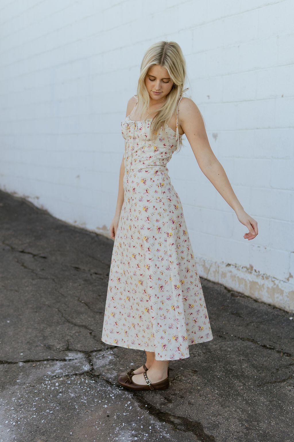beige dress with red and yellow flower print