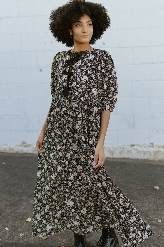 Black floral dress with bow details on the front