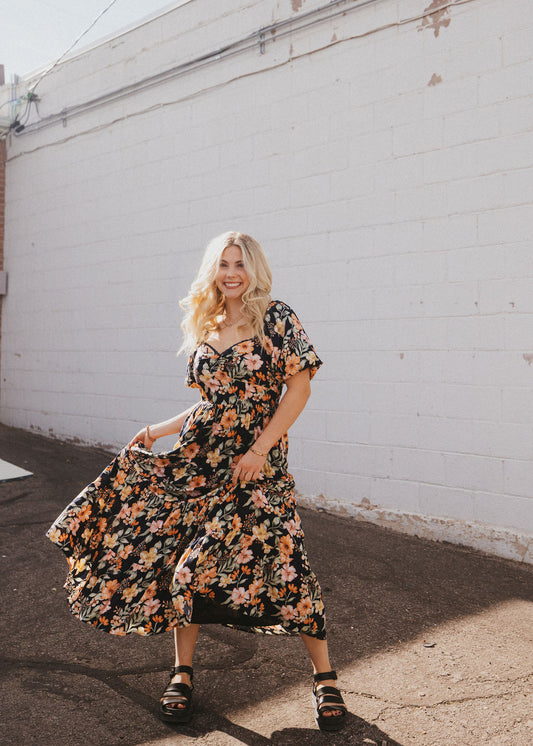 black floral dress with sweetheart neckline and puff sleeves