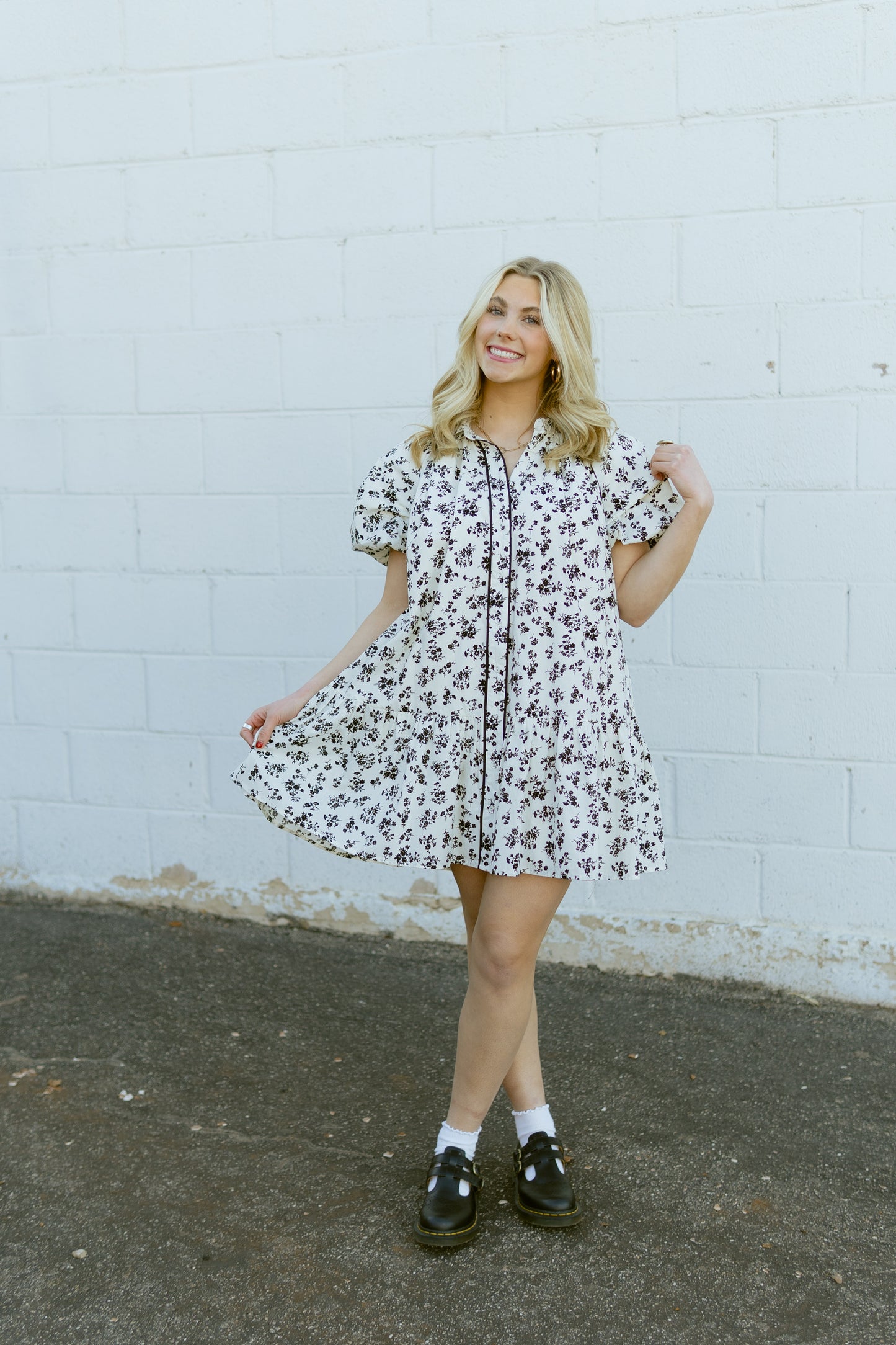 white a-line mini dress with black floral pattern