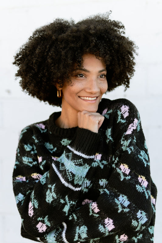 black crewneck sweater with pink and green flower print