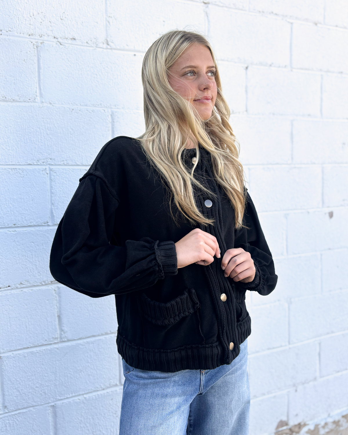 Black , loose fitting sweater jacket