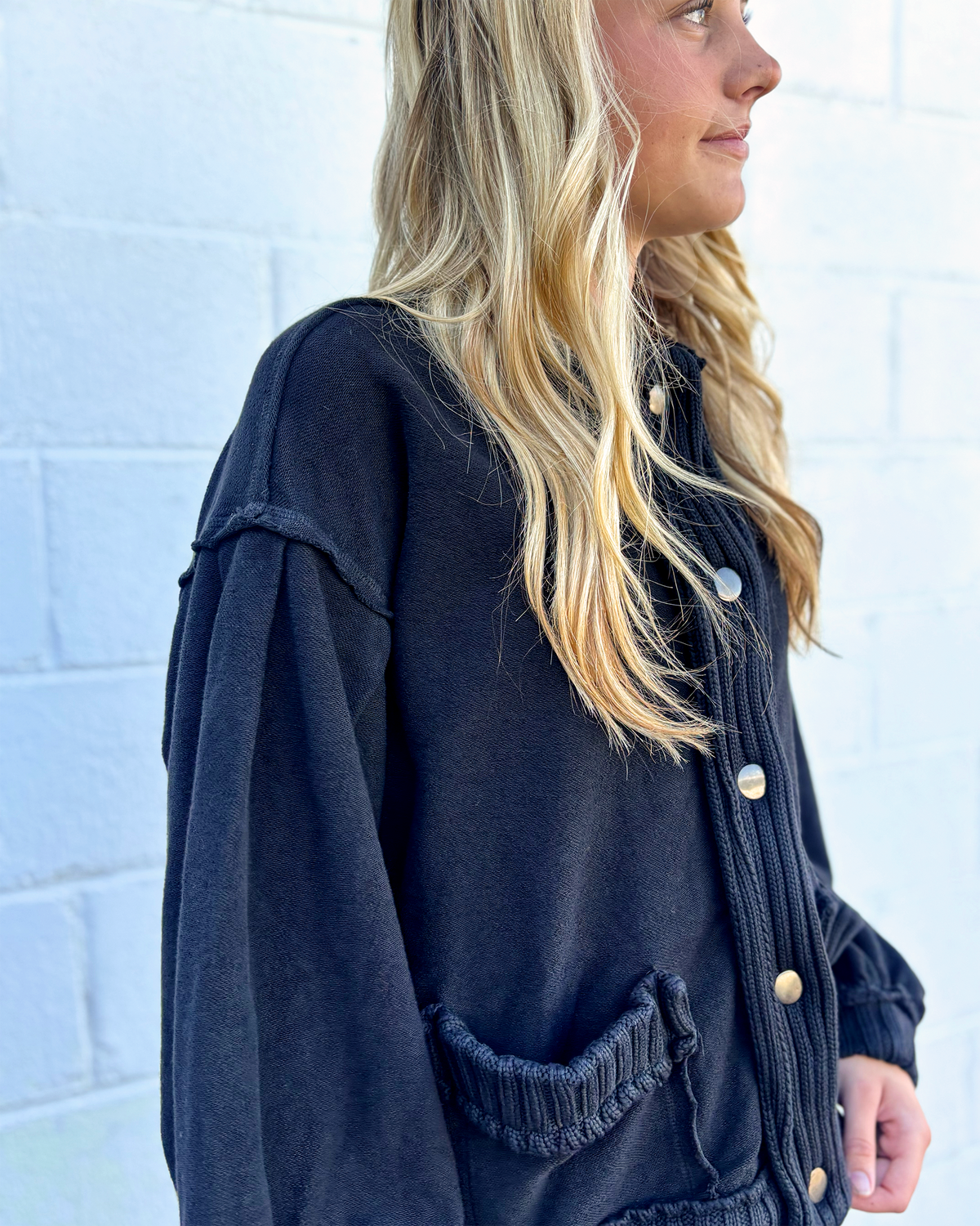 Black , loose fitting sweater jacket