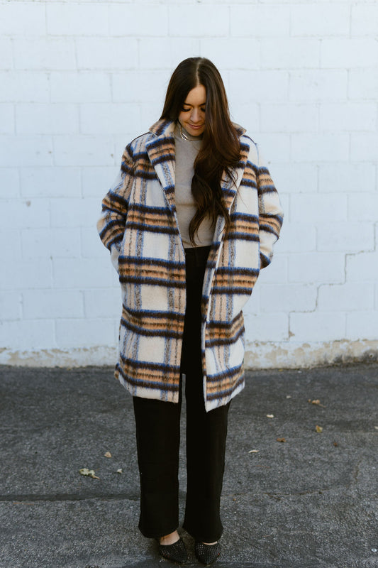 Blue, brown, and ivory plaid trench coat