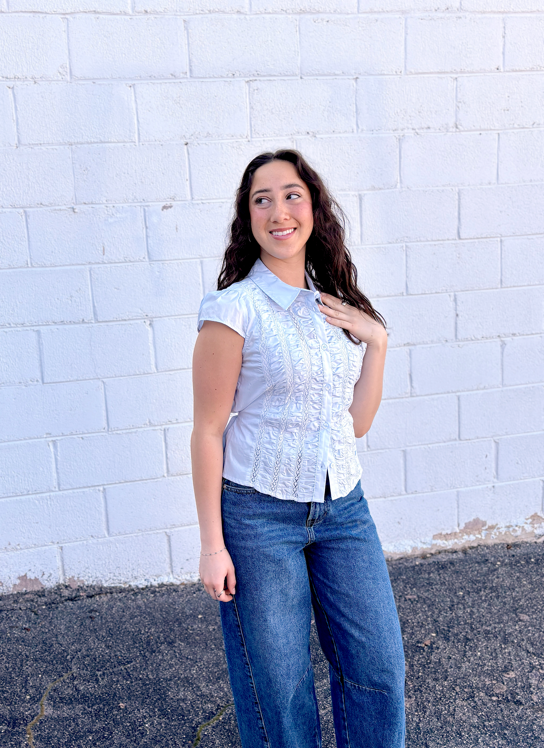light blue button up top with ruching and a tie in the back