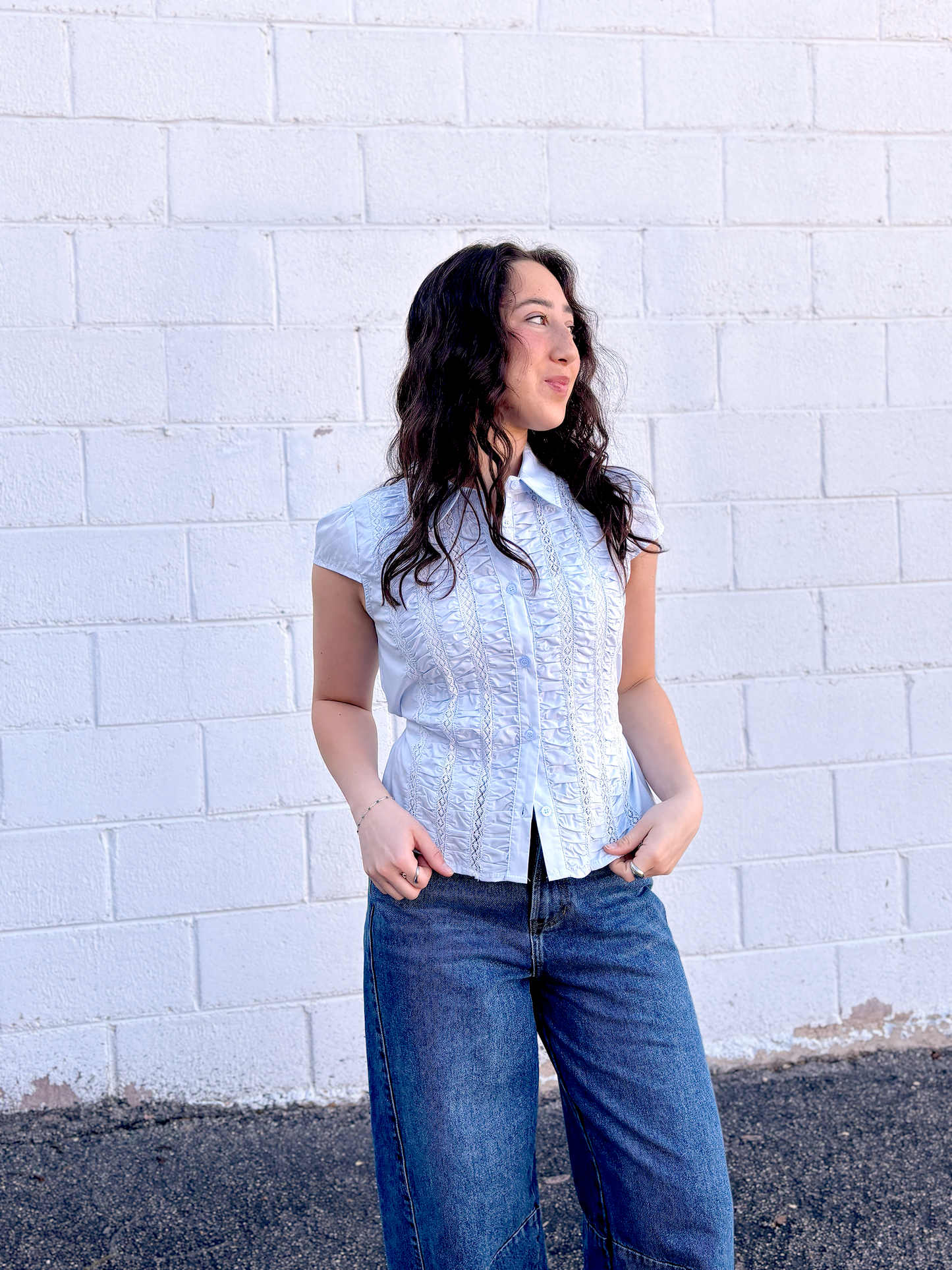 light blue button up top with ruching and a tie in the back
