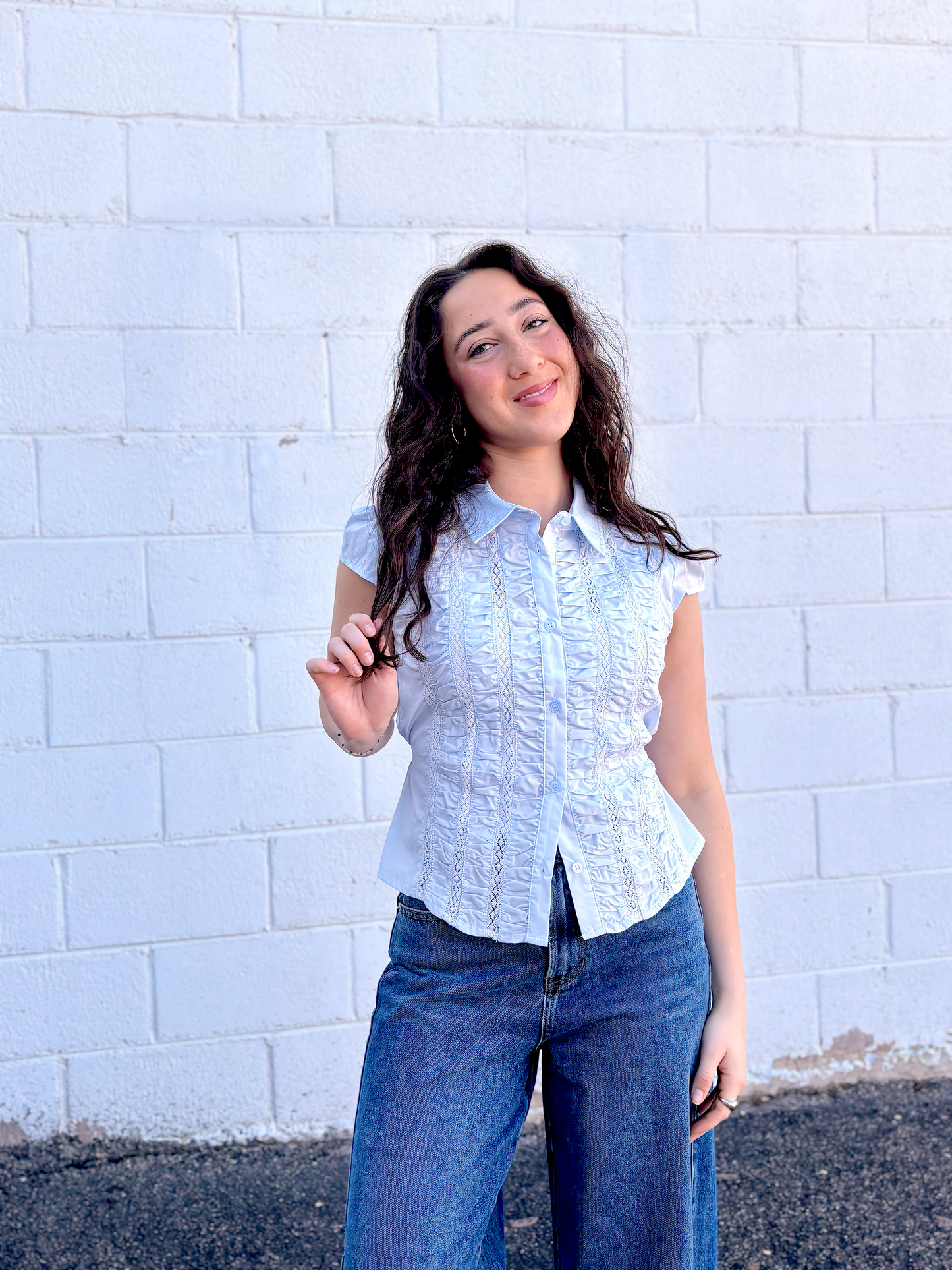 light blue button up top with ruching and a tie in the back