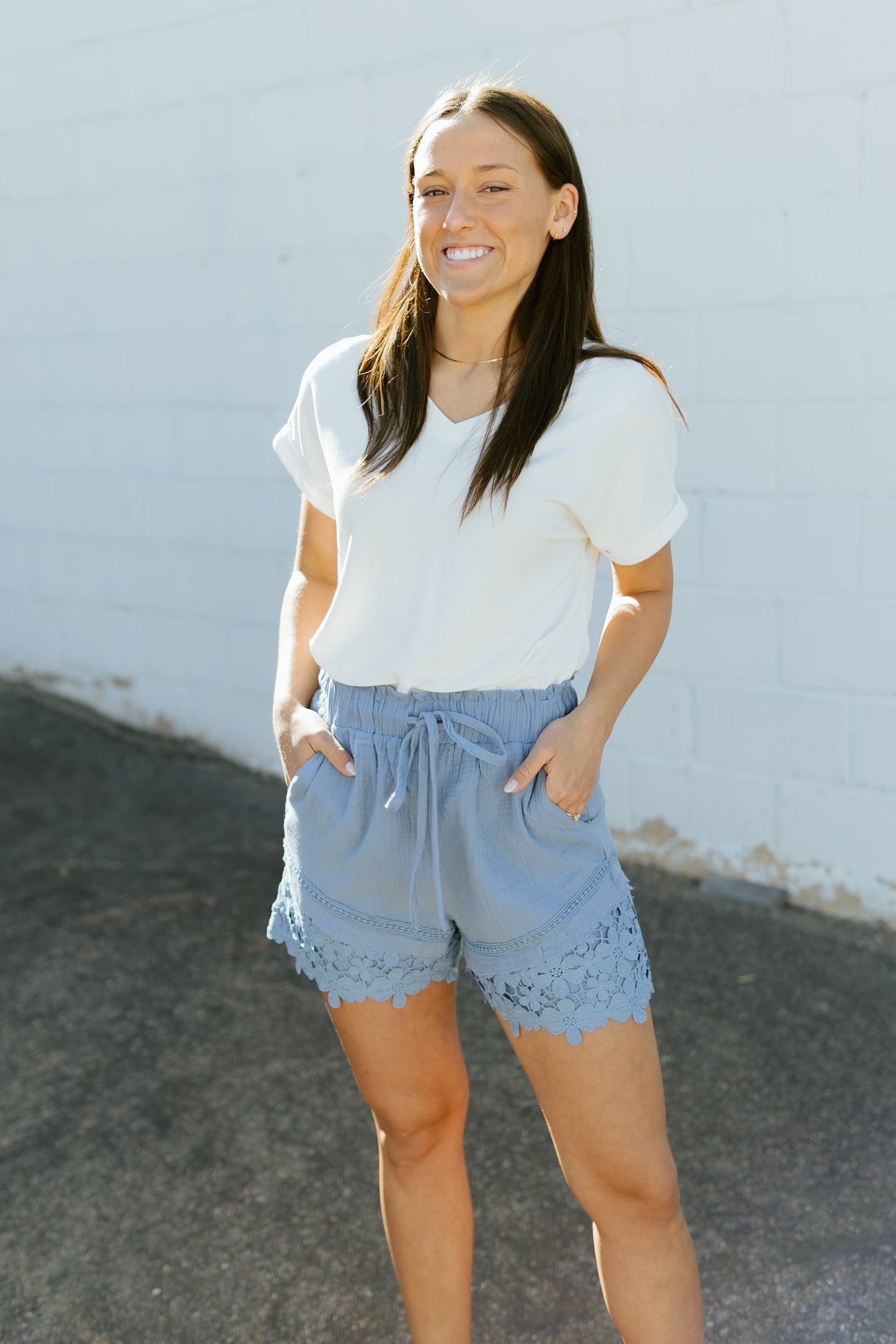 Blue shorts with crochet lace along the bottom