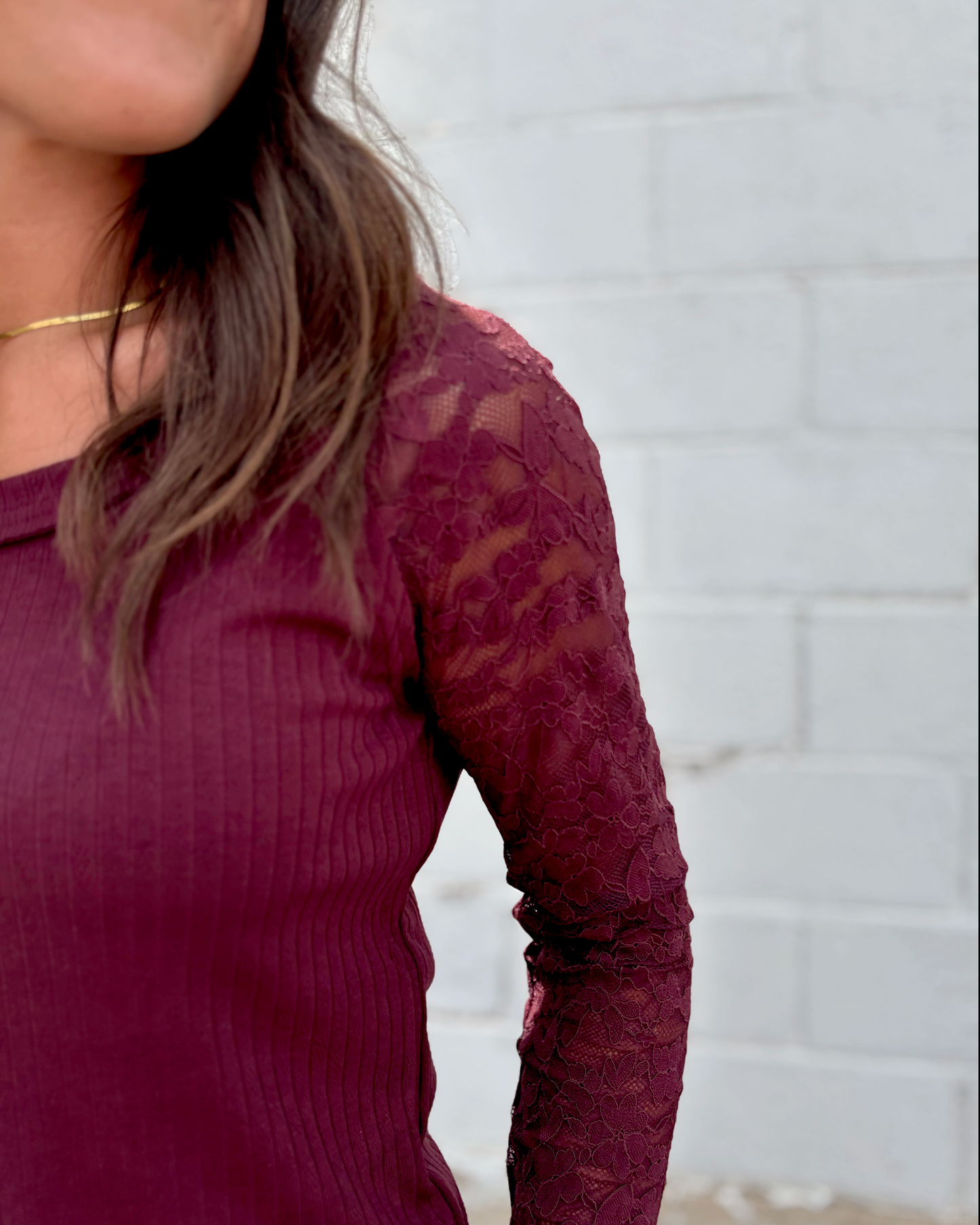 Burgundy top with lace long sleeves and scoop neckline