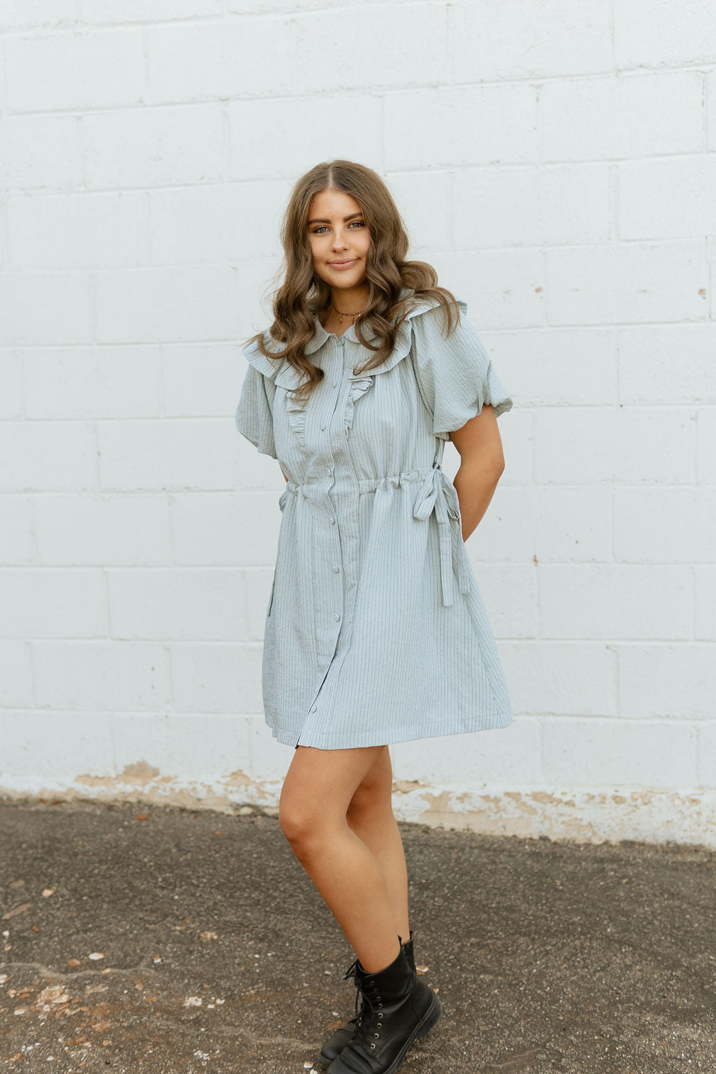 Light blue dress with two bow ties at the waist 