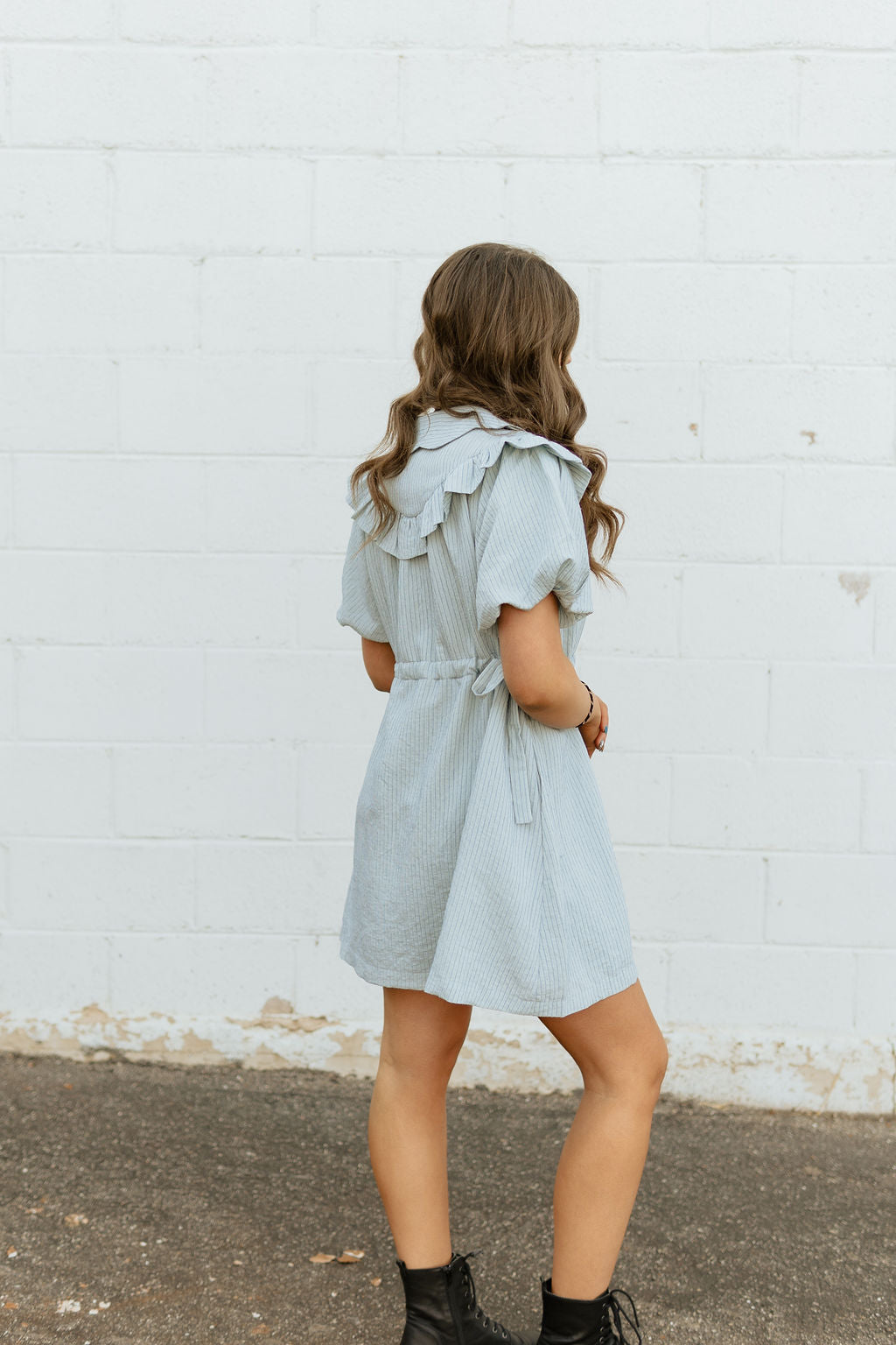 Light blue dress with two bow ties at the waist 