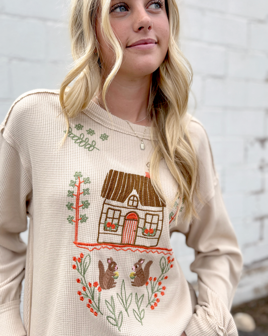 Cute tan thermal top with embroidered squirrel family on the front