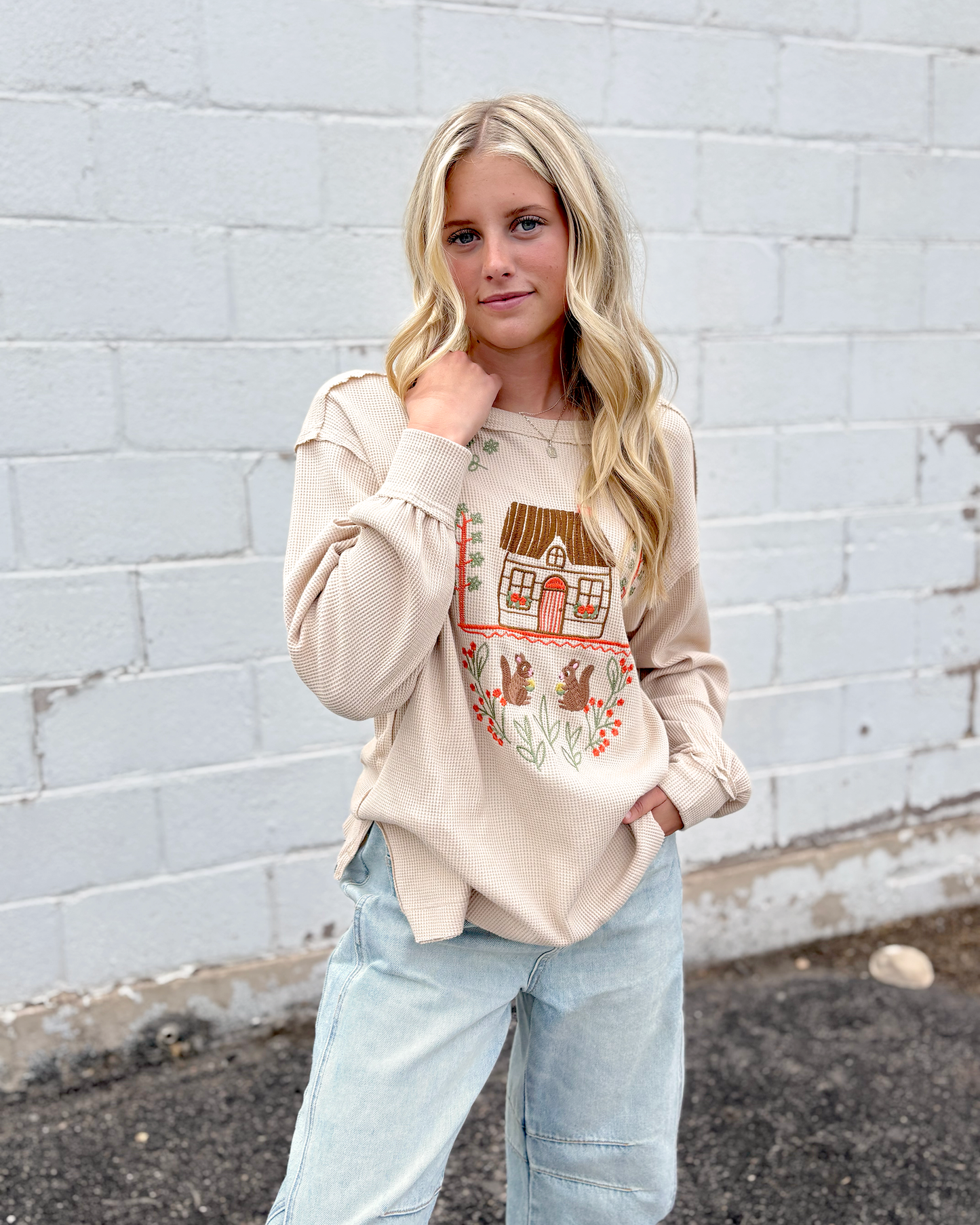 Cute tan thermal top with embroidered squirrel family on the front