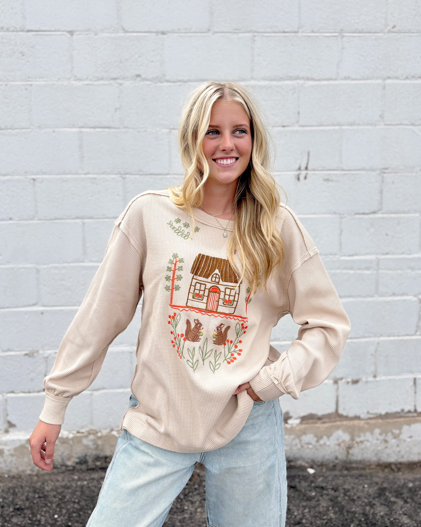Cute tan thermal top with embroidered squirrel family on the front