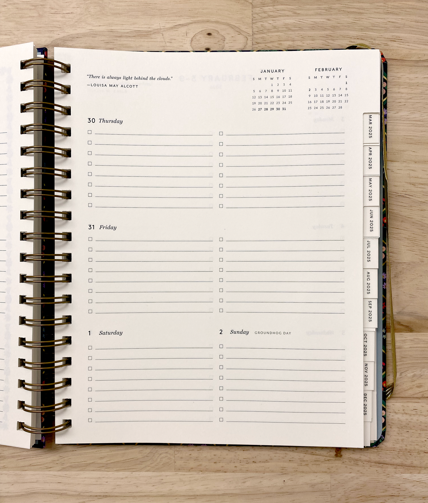 Rifle Paper Co 17-month planner with spiral binding, goals planner, sticker sheets, note pages, and a pocket folder